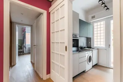 a kitchen with a washer and dryer in a room at Daniela's Place in Rome