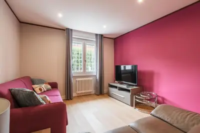 a living room with a couch and a tv at Daniela's Place in Rome
