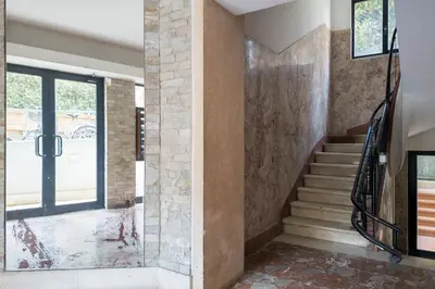 a staircase in a house with a glass door at Daniela's Place in Rome
