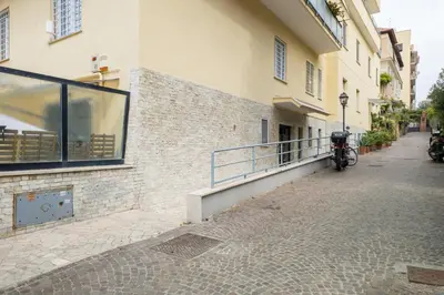 a motorcycle parked on the side of a building at Daniela's Place in Rome
