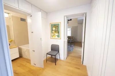 a room with a chair and a bathroom at Charm and Style by Campo de Fiori in Rome