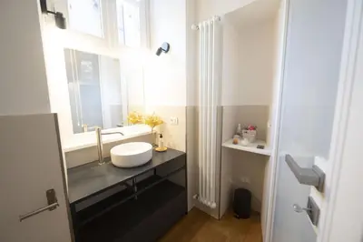 a bathroom with a sink and a window at Charm and Style by Campo de Fiori in Rome