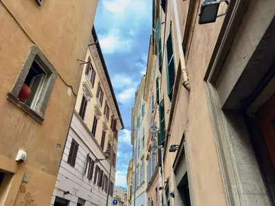 a view of an alley between two buildings at Charm and Style by Campo de Fiori in Rome