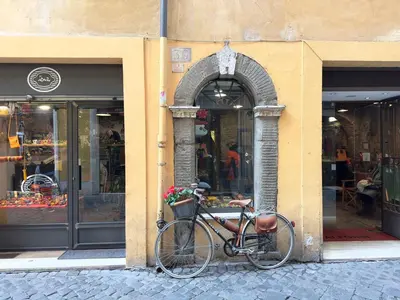 a bike parked on the side of a building at Charm and Style by Campo de Fiori in Rome