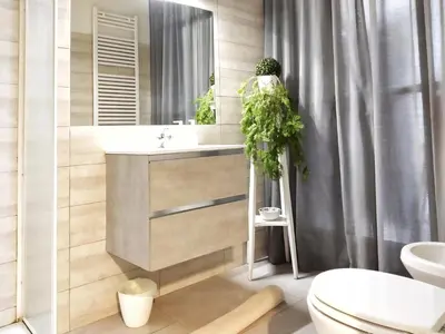 a bathroom with a sink and a mirror and a toilet at 
