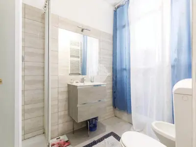 a bathroom with a sink and a toilet and a shower at 