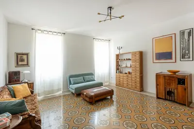 a living room with a couch and a chair at Residenza Urbana in Rome
