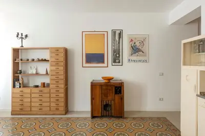 a room with a dresser and a wooden cabinet at Residenza Urbana in Rome