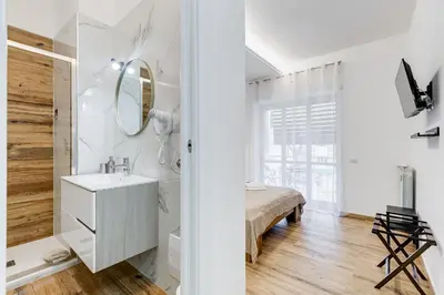 a bathroom with a sink and a mirror at VATICANDREAM GUEST HOUSE in Rome