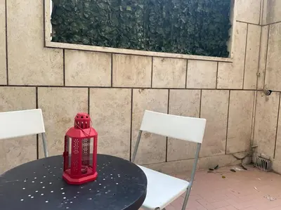 a red fire hydrant sitting on top of a table at Your comfy Home in Rome