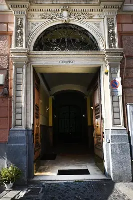 an entrance to a building with an arch over the door at St Peter Regal Apartment in Rome