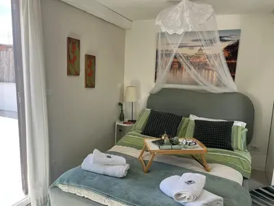 a bedroom with a bed with a table on it at Monteverde Double Terrace Penthouse in Rome