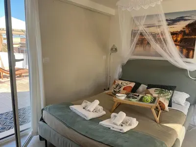 a bedroom with a bed with towels on it at Monteverde Double Terrace Penthouse in Rome