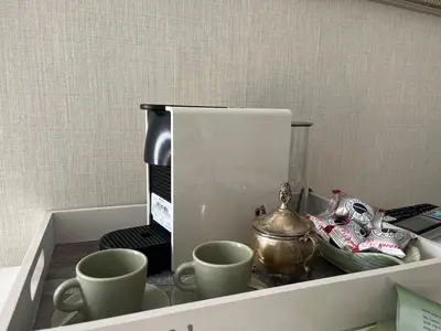 a drawer with cups and a tea pot on it at Monteverde Double Terrace Penthouse in Rome