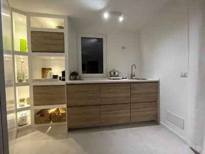 a bathroom with a sink and a mirror at Monteverde Double Terrace Penthouse in Rome