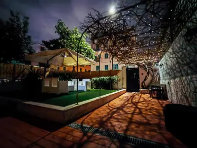 a view of a courtyard with a house at Moderno appartamento Cornelia-San Pietro con Giardino in Rome