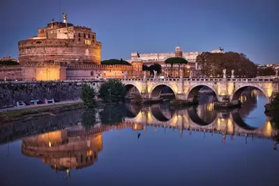 a castle and a bridge over a river at Moderno appartamento Cornelia-San Pietro con Giardino in Rome