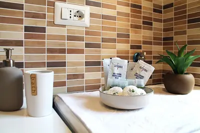 a kitchen counter with a bowl of food on a counter top at San Pietro Sweet RHome in Rome