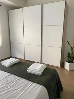 a bedroom with a bed with two towels on it at San Pietro Sweet RHome in Rome