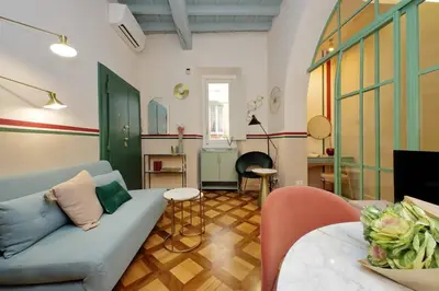 a living room with a couch and a table at YCH-Bright Suite Navona in Rome