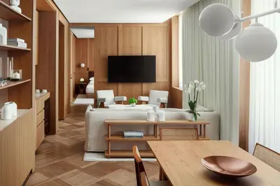 a bedroom with a large bed with a blanket on it at The Rome EDITION in Rome