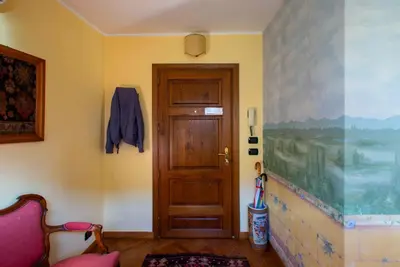 a room with a wooden door and a wall at Angel's Terrace in Rome
