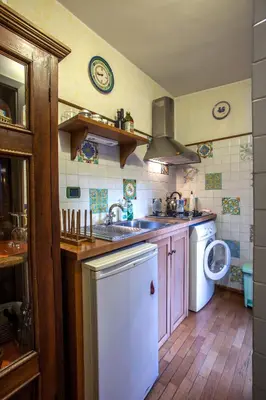 a kitchen with a sink and a washing machine at Angel's Terrace in Rome