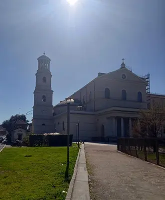 a large white building with a clock tower at StarHome San Paolo in Rome