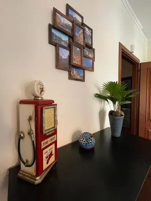 a table with a gas pump and a plant on it at Casa Alessi in Rome elegant, spacious and comfortable apartment in Rome
