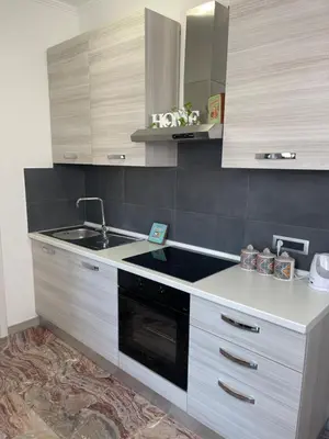 a kitchen with a sink and a stove at Henry Suite in Rome