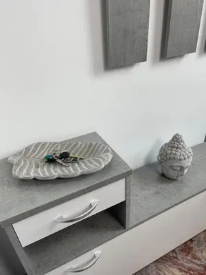 a table with a plate on top of it at Henry Suite in Rome