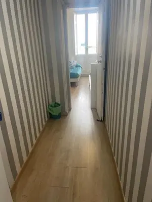 a hallway of a room with a wooden floor at Casa di Mochi in Rome