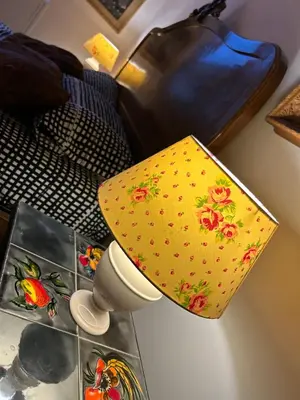 a lamp with a yellow cover on a table at Home Rome Lepanto in Rome