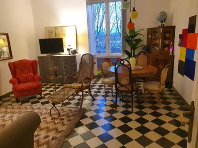 a living room with a table and chairs at Home Rome Lepanto in Rome