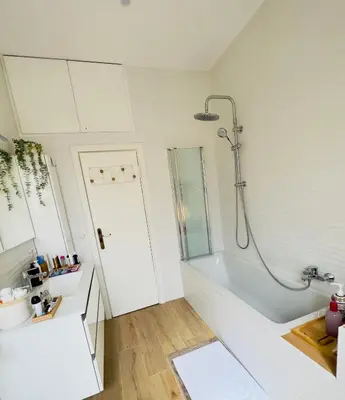 a white bathroom with a shower and a tub at Gemelli-San Pietro-Trastevere-casa con posto auto in Rome