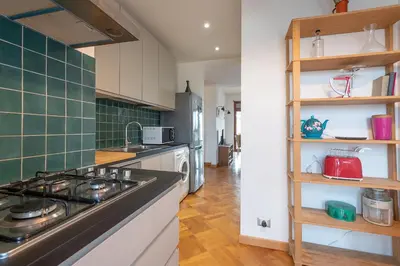 a kitchen with a stove and a counter top at Matilde's view apartment Saint Peter in Rome