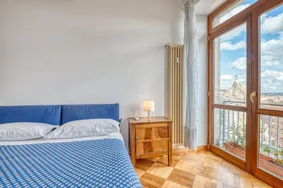 a bedroom with a bed and a window at Matilde's view apartment Saint Peter in Rome