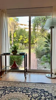 a living room with a large sliding glass door at Villette Aldobrandeschi Urban Oasis Vacation Homes in Rome