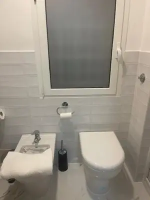 a small bathroom with a toilet and a sink at Appartamento int 1 in Rome