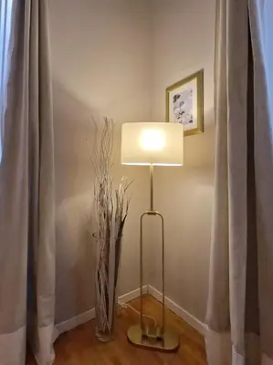 a lamp sitting on a table next to a curtain at Navona Gold Apartment in Rome