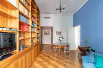 a living room with a couch and a television and a table at iFlat The gem of the center in Rome