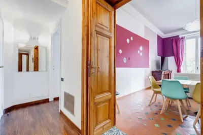 a room with a door and a table and chairs at BMGA l Luxury 3Bdr Apt with Stunning View in City Center in Rome