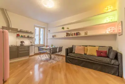 a living room with a couch and a table at iFlat Apê Ponte Sisto in Rome