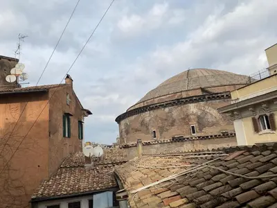 a view of a building with a dome in the background at Pantheon Design Apartment in Rome