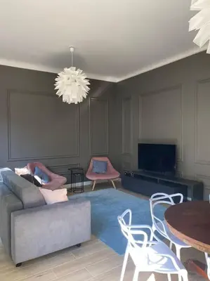 a living room with a couch and a table at Trastevere Design Apartment in Rome