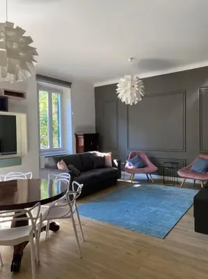 a living room with a couch and a table at Trastevere Design Apartment in Rome