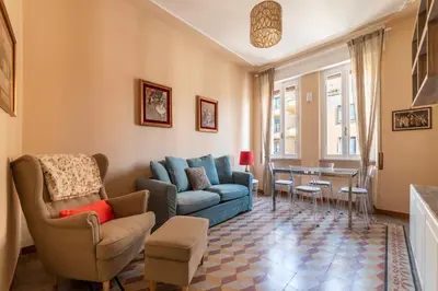 a living room with a couch and chairs and a table at GuestHost - Bright APT - San Pietro & Castel Sant'Angelo in Rome