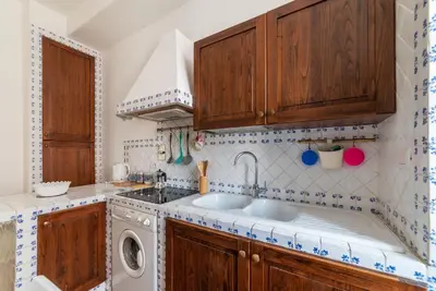 a kitchen with a sink and a washing machine at GuestHost - Bright APT - San Pietro & Castel Sant'Angelo in Rome