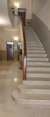 a stairway in a building with a spiral staircase at Pariolina in Rome