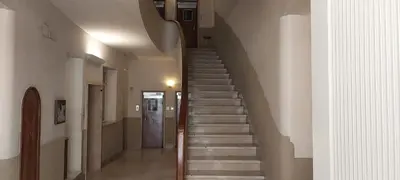 a staircase in a building with a stair case at Pariolina in Rome